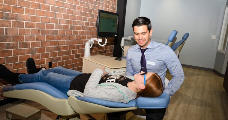 Dr. Silvestre with a patient